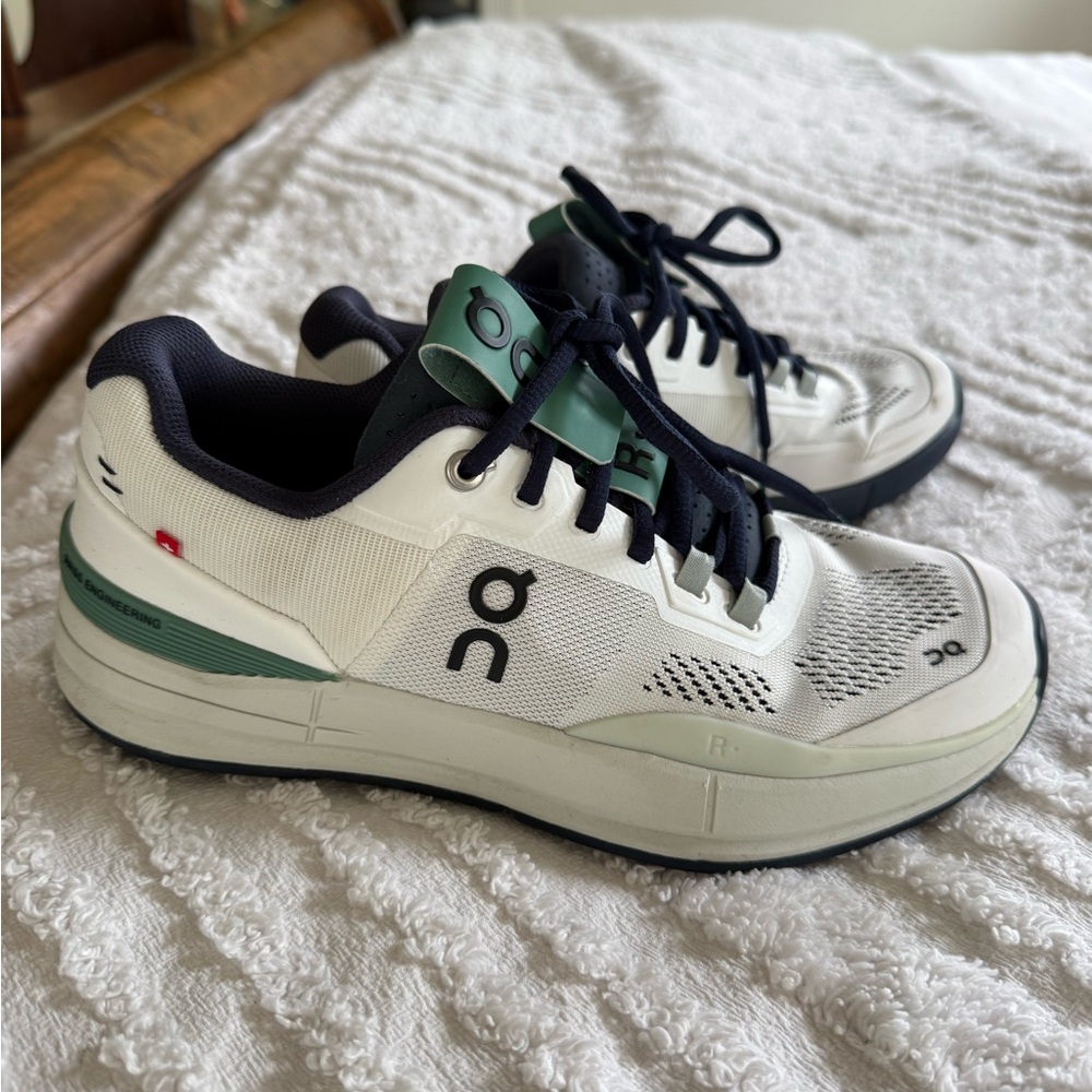 On Running White and Green Sneakers with CloudTec Cushioning